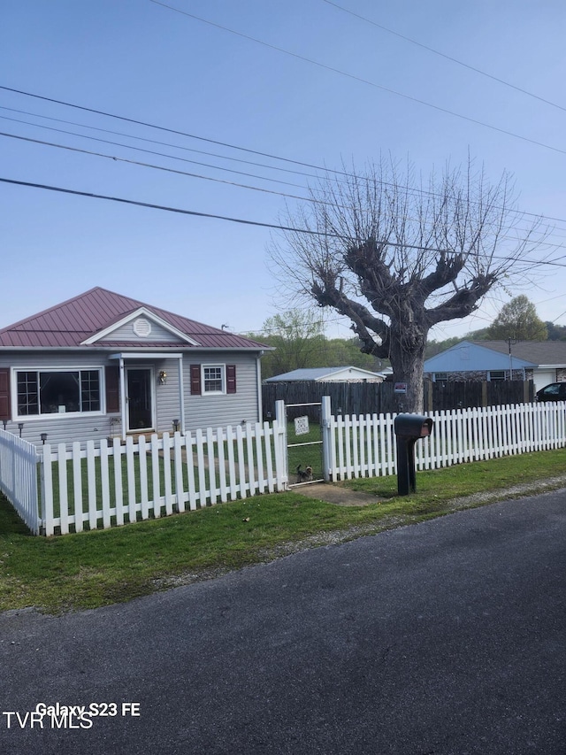 127 Banner St, Erwin, TN 37650 - view of front of property with a fenced front yard and metal roof