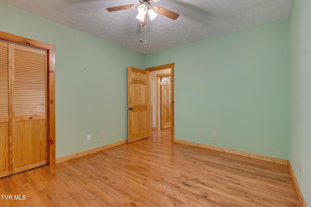 366 Judge Ben Allen Rd, Elizabethton, TN 37643 - unfurnished bedroom featuring wood finished floors, a textured ceiling, baseboards, a closet, and ceiling fan