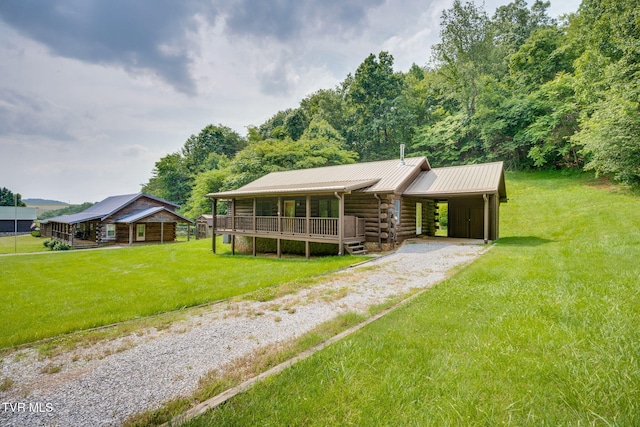 366 Judge Ben Allen Rd, Elizabethton, TN 37643 - log cabin featuring driveway, log exterior, a front lawn, metal roof, and covered porch