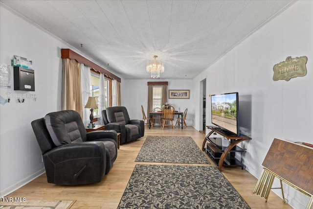 204 E Millpond St, Kingsport, TN 37660 - living room featuring a chandelier, light wood-type flooring, and crown molding