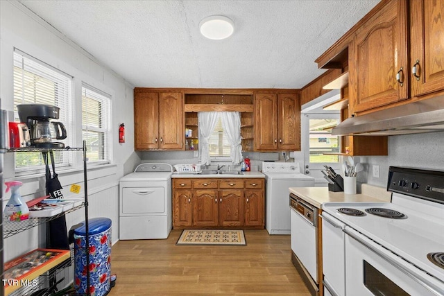204 E Millpond St, Kingsport, TN 37660 - kitchen featuring white appliances, under cabinet range hood, washer and dryer, open shelves, and brown cabinets
