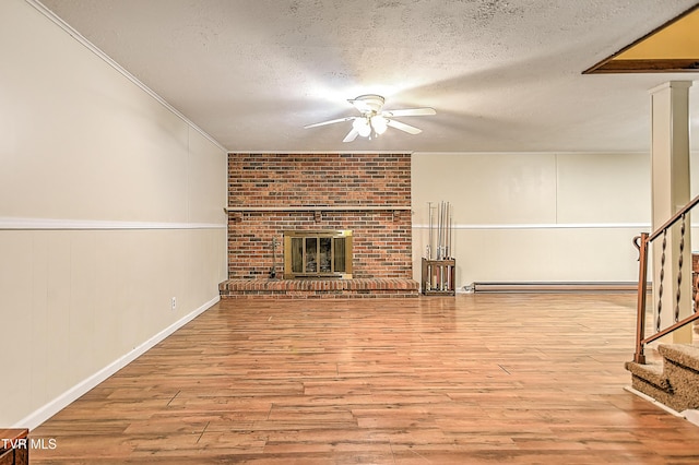 112 Hillview Rd, Kingsport, TN 37664 - unfurnished living room with ceiling fan, baseboard heating, stairway, a textured ceiling, and wood finished floors
