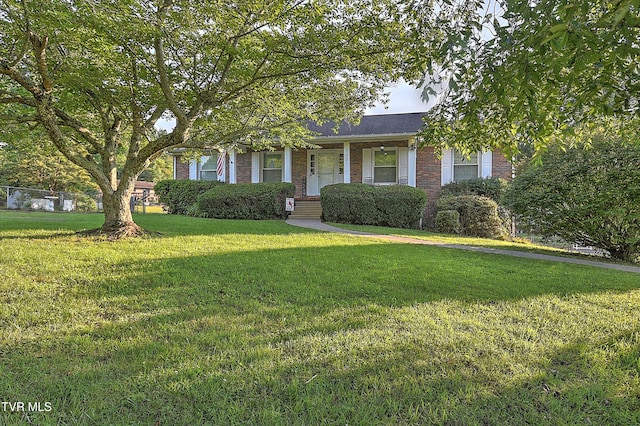 112 Hillview Rd, Kingsport, TN 37664 - obstructed view of property featuring brick siding, a front lawn, and a porch