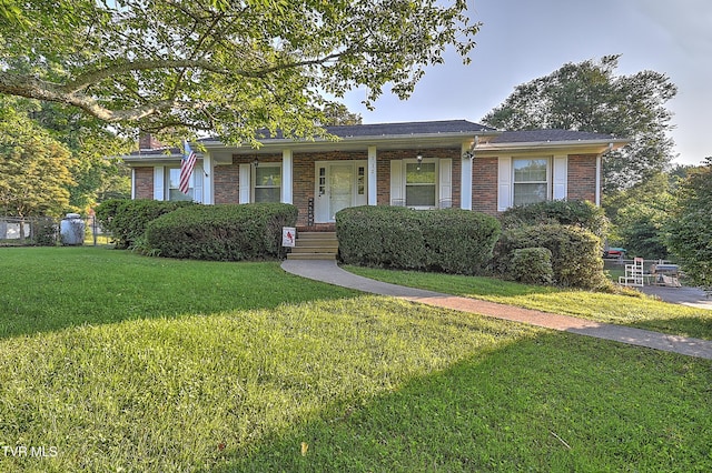 112 Hillview Rd, Kingsport, TN 37664 - view of front of house with brick siding, a front lawn, a porch, and a chimney