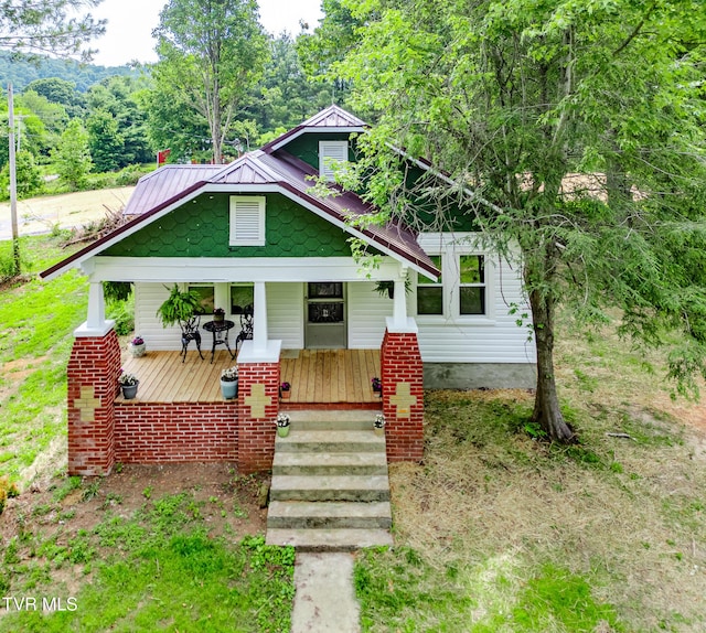 740 Fishpond Rd, Chuckey, TN 37641 - bungalow featuring a porch, a metal roof, and a standing seam roof