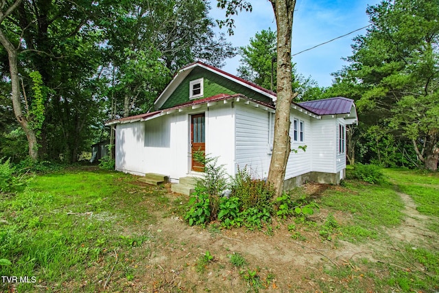 740 Fishpond Rd, Chuckey, TN 37641 - view of property exterior featuring a metal roof and entry steps