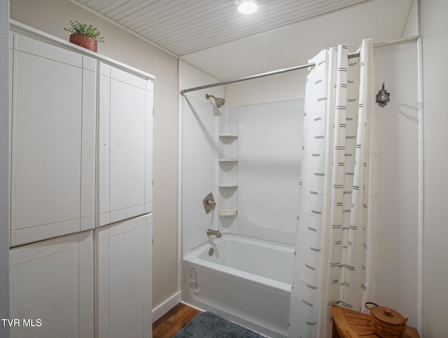 740 Fishpond Rd, Chuckey, TN 37641 - bathroom with shower / bath combo with shower curtain and wood finished floors