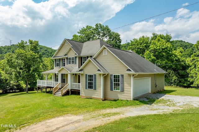 2898 Watauga Rd, Johnson City, TN 37601 - view of front facade with covered porch, gravel driveway, a front yard, an attached garage, and roof with shingles