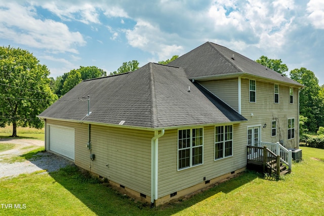 2898 Watauga Rd, Johnson City, TN 37601 - back of house with crawl space, driveway, a yard, central AC, and a garage