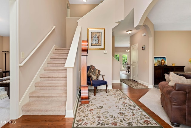 2898 Watauga Rd, Johnson City, TN 37601 - stairway with wood finished floors, arched walkways, and baseboards