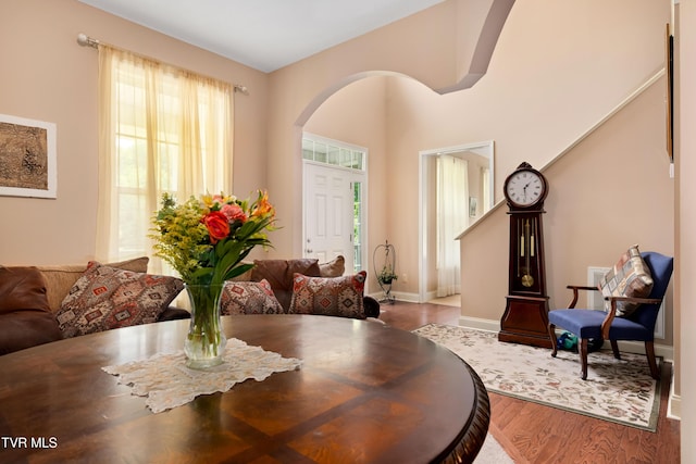 2898 Watauga Rd, Johnson City, TN 37601 - dining area featuring arched walkways, healthy amount of natural light, wood finished floors, and baseboards