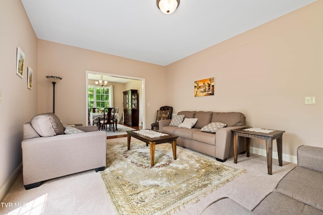 2898 Watauga Rd, Johnson City, TN 37601 - living room with a chandelier, carpet flooring, and baseboards