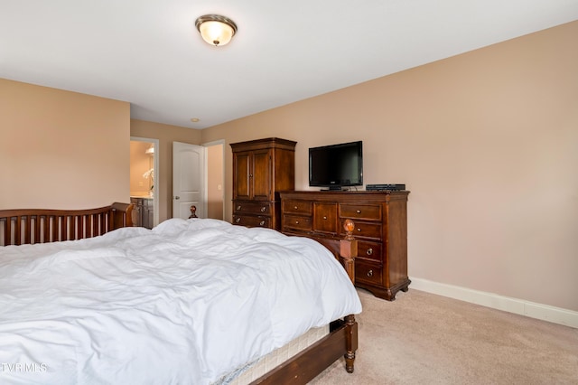 2898 Watauga Rd, Johnson City, TN 37601 - bedroom with light carpet, baseboards, and connected bathroom