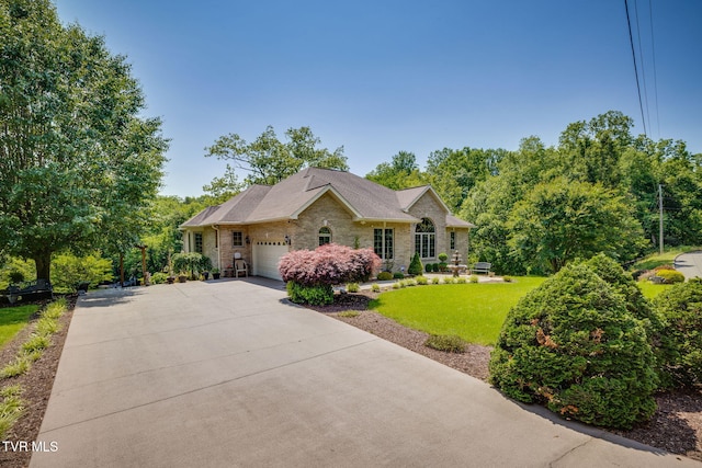 100 Pointe Dr, Piney Flats, TN 37686 - view of front of house with an attached garage, a front lawn, brick siding, and concrete driveway