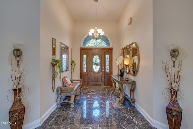 100 Pointe Dr, Piney Flats, TN 37686 - foyer entrance with marble tiled flooring, a chandelier, a high ceiling, and baseboards
