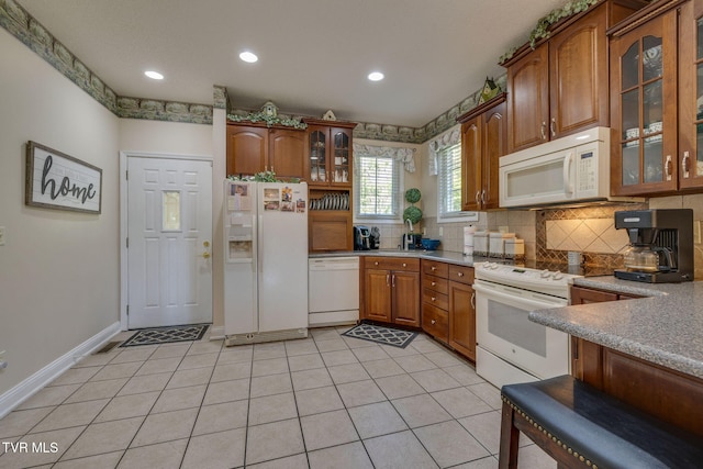 100 Pointe Dr, Piney Flats, TN 37686 - kitchen featuring white appliances, decorative backsplash, brown cabinetry, glass insert cabinets, and recessed lighting