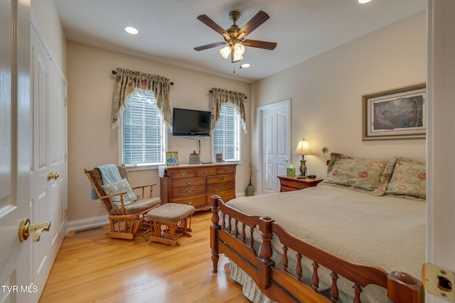100 Pointe Dr, Piney Flats, TN 37686 - bedroom with light wood-style flooring, recessed lighting, a closet, baseboards, and ceiling fan