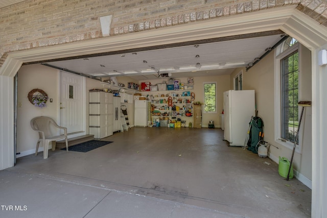 100 Pointe Dr, Piney Flats, TN 37686 - garage with freestanding refrigerator and baseboards