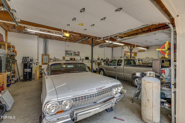 100 Pointe Dr, Piney Flats, TN 37686 - garage featuring a garage door opener and electric panel