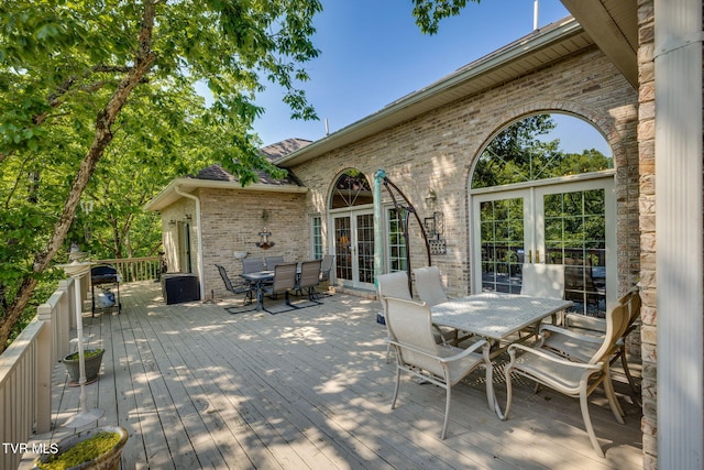 100 Pointe Dr, Piney Flats, TN 37686 - deck with outdoor dining area and french doors