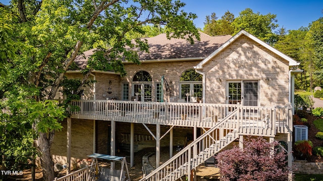 100 Pointe Dr, Piney Flats, TN 37686 - back of property featuring a deck, brick siding, a shingled roof, and stairway