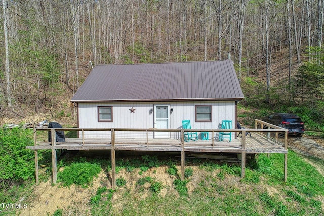 7300 Snake Hollow Rd, Sneedville, TN 37869 - back of house with a wooden deck, metal roof, and a wooded view