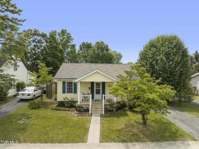 2012 Euclid Ave, Bristol, VA 24201 - bungalow-style house with covered porch, a front yard, a shingled roof, and driveway