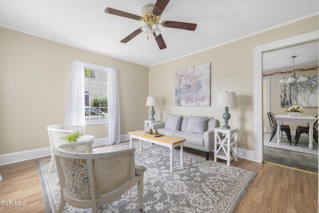 2012 Euclid Ave, Bristol, VA 24201 - living area featuring wood finished floors, baseboards, a ceiling fan, and crown molding