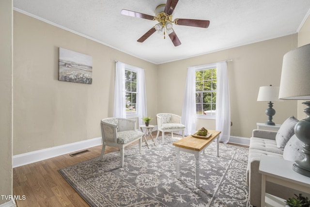 2012 Euclid Ave, Bristol, VA 24201 - living room featuring a ceiling fan, ornamental molding, wood finished floors, and baseboards