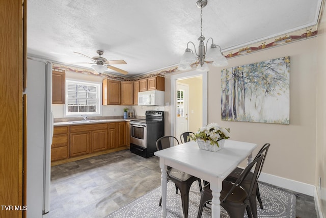 2012 Euclid Ave, Bristol, VA 24201 - dining area featuring a chandelier, a ceiling fan, a textured ceiling, and baseboards