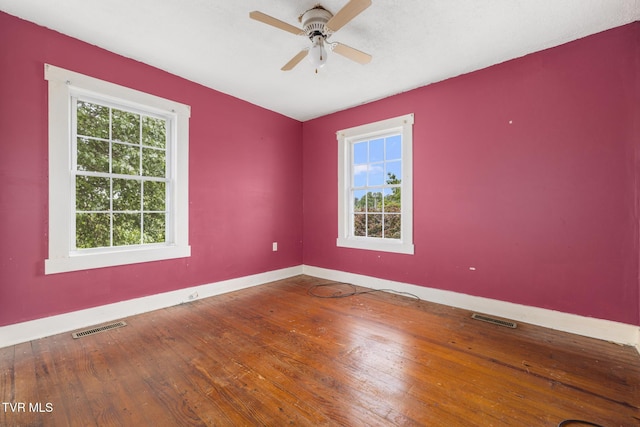 2012 Euclid Ave, Bristol, VA 24201 - spare room featuring plenty of natural light, hardwood / wood-style floors, baseboards, and a ceiling fan