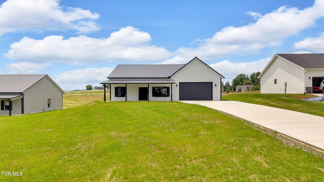 1930 Erwin Hwy, Greeneville, TN 37745 - modern farmhouse style home with driveway, a standing seam roof, a garage, a metal roof, and a front yard