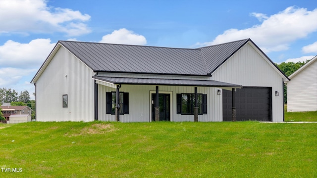 1930 Erwin Hwy, Greeneville, TN 37745 - view of front of home with a garage, a front lawn, a metal roof, and a standing seam roof