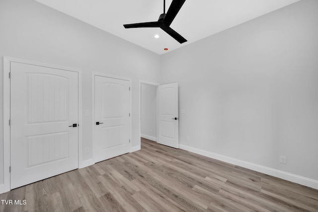 1930 Erwin Hwy, Greeneville, TN 37745 - unfurnished bedroom with wood finished floors, ceiling fan, recessed lighting, and a towering ceiling