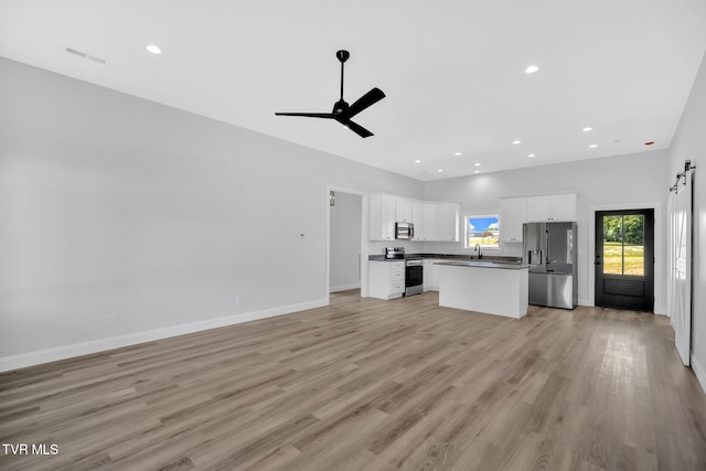 1930 Erwin Hwy, Greeneville, TN 37745 - unfurnished living room featuring a ceiling fan, light wood-type flooring, and recessed lighting