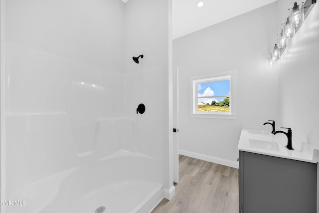 1930 Erwin Hwy, Greeneville, TN 37745 - bathroom featuring wood finished floors, double vanity, and a shower