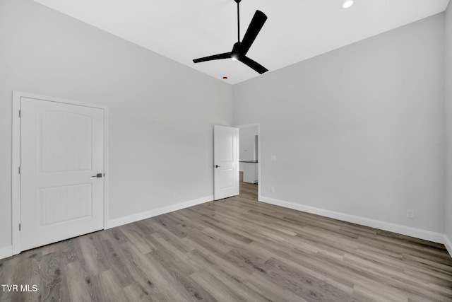 1930 Erwin Hwy, Greeneville, TN 37745 - unfurnished bedroom featuring wood finished floors, a ceiling fan, recessed lighting, and high vaulted ceiling