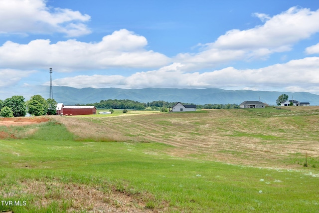 1930 Erwin Hwy, Greeneville, TN 37745 - view of property's community featuring a mountain view, a view of countryside, dirt driveway, and an outdoor structure