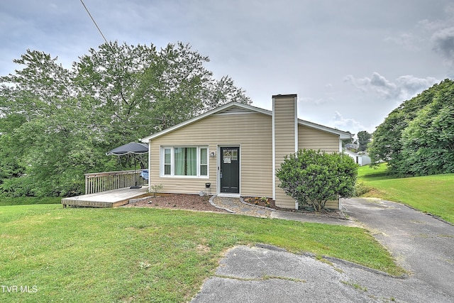 1026 Clark St, Bristol, VA 24201 - view of front of home featuring a front lawn, a deck, and a chimney