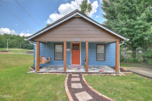 165 Hughes St, Bristol, VA 24201 - view of front facade featuring a front lawn and a porch
