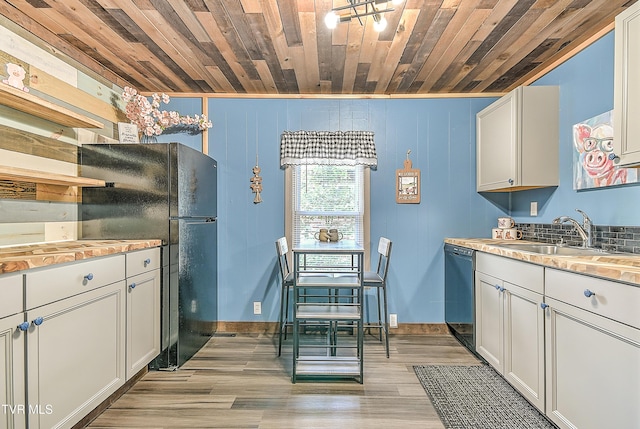 165 Hughes St, Bristol, VA 24201 - kitchen featuring a sink, dishwasher, wood ceiling, light wood-type flooring, and freestanding refrigerator