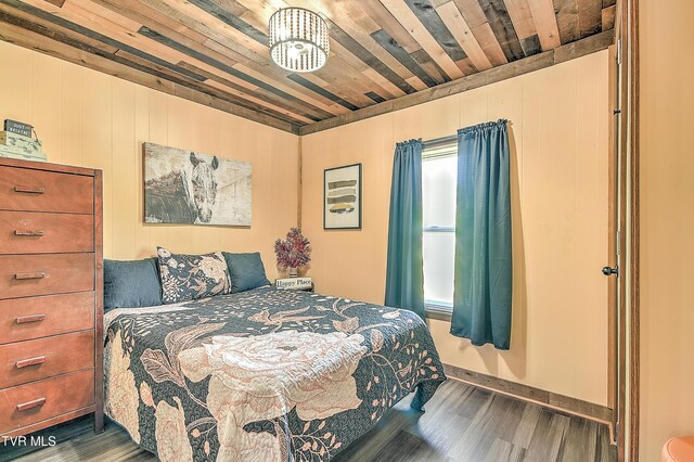 165 Hughes St, Bristol, VA 24201 - bedroom featuring wood finished floors, wooden ceiling, and baseboards