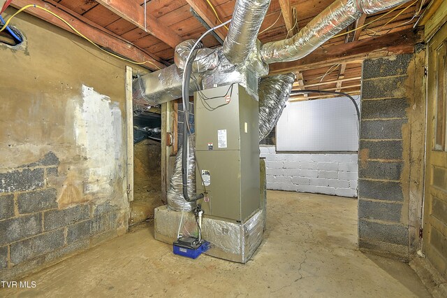 165 Hughes St, Bristol, VA 24201 - unfinished basement featuring concrete block wall and heating unit