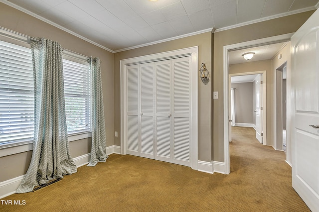 1241 Carolina Ave, Bristol, TN 37620 - unfurnished bedroom featuring light carpet, crown molding, a closet, and baseboards