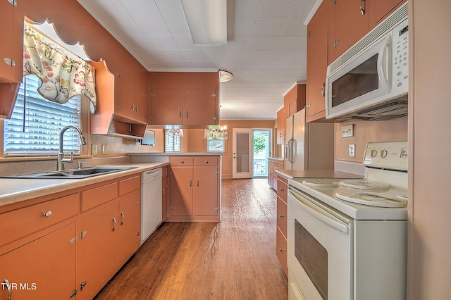 1241 Carolina Ave, Bristol, TN 37620 - kitchen with white appliances, a sink, light wood finished floors, light countertops, and a peninsula