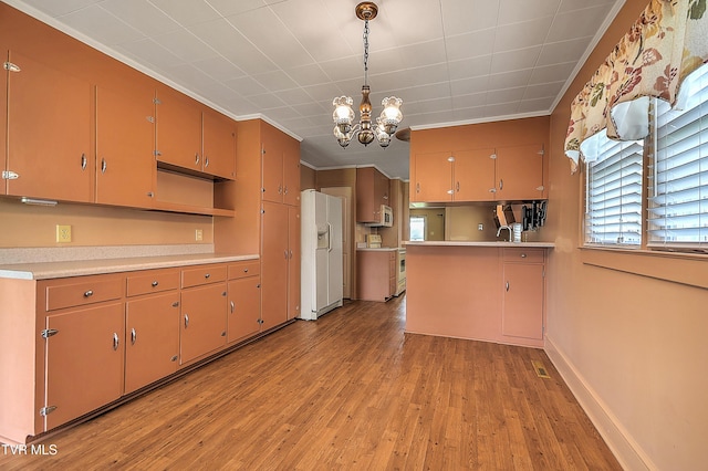 1241 Carolina Ave, Bristol, TN 37620 - kitchen with white refrigerator with ice dispenser, ornamental molding, range, a chandelier, and light wood finished floors