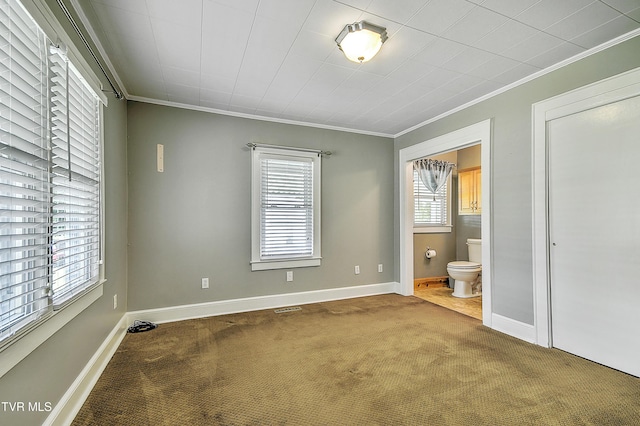1241 Carolina Ave, Bristol, TN 37620 - unfurnished bedroom featuring carpet floors, crown molding, baseboards, and ensuite bathroom