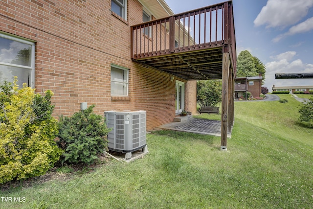 296 Redstone Dr, Bluff City, TN 37618 - view of green lawn with cooling unit, a wooden deck, and a patio area
