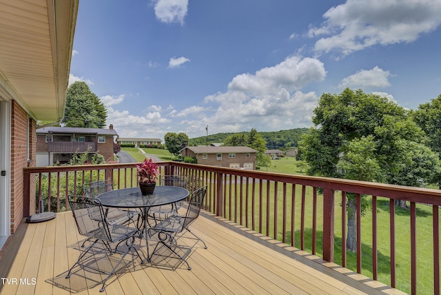 296 Redstone Dr, Bluff City, TN 37618 - wooden terrace with outdoor dining space, a yard, and a residential view