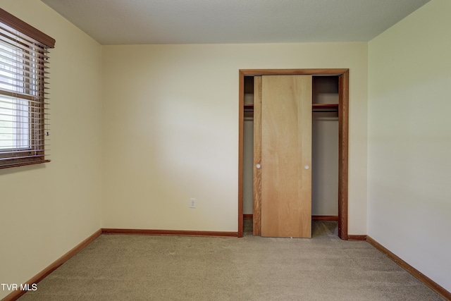 296 Redstone Dr, Bluff City, TN 37618 - unfurnished bedroom with carpet flooring, a closet, and baseboards